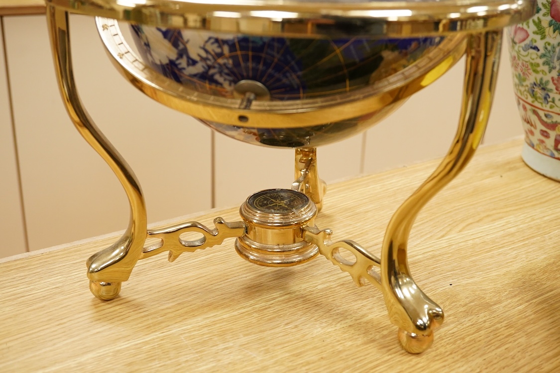 A simulated multi-mineral globe with compass, 30cm in diameter